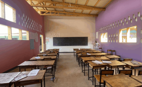 A large classroom with rows of desks