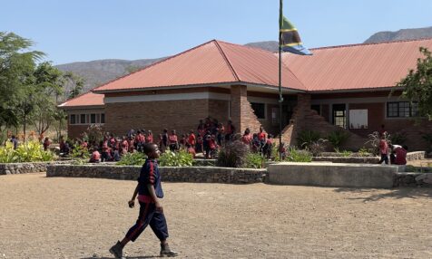 Students gathered outside of a building