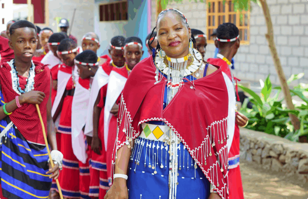 A woman wearing traditional clothing with a line of students behind her