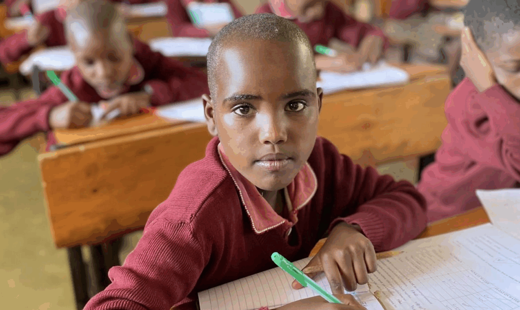 Students seated at desks in a classroom